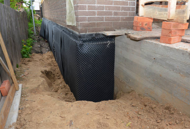 SJ Waterproofing Pros technician performing targeted Interior Drainage System assessment in Hancock, WI